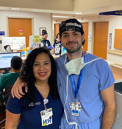 Dr. Ohanisian and co-worker at reception desk in hospital